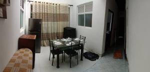 a dining room with a glass table and chairs at Villa 307 8 room 22 guest appartment in Matara