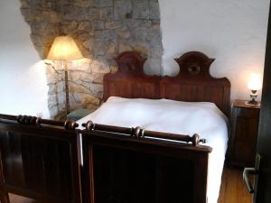 Postelja oz. postelje v sobi nastanitve Kmetija Medljan