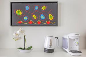 a coffeemaker and a coffee maker on a counter at Beautiful Apartment city center in Vienna