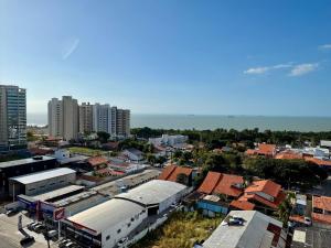 an aerial view of a city with buildings and the ocean at (1209)Studio com vista panorâmica mar in São Luís