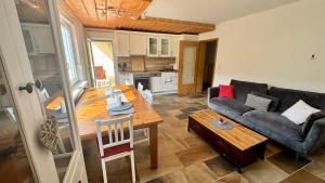 a living room with a couch and a table at Gemütliche Auszeit in Burg