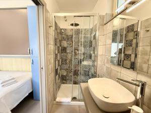a bathroom with a sink and a shower at B&B Il Tramonto in Capo dʼOrlando +89 photos