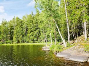 a body of water with trees in the background at 5 person holiday home in Mellösa in Mellösa +40 photos