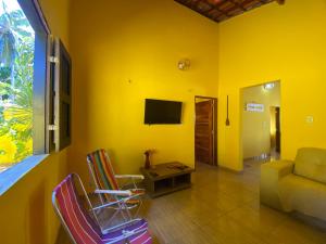 TV a/nebo společenská místnost v ubytování Casa Amarela em Icaraí de Amontada + 36 fotografií