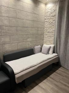 Ένα ή περισσότερα κρεβάτια σε δωμάτιο στο Apartman M&A