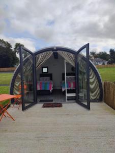 a tent with two beds inside of it at Canal Stay in Cloondara +7 photos