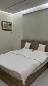 En eller flere senge i et værelse på Apartment Room Lounge & Bathroom