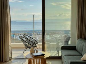 a living room with a view of the ocean at Marathon Coast-Seafront Luxury Apartments in Nea Makri