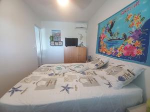 En eller flere senge i et værelse på Villa Toc Toc à Bouillante, Guadeloupe