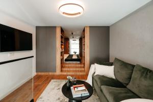 a living room with a couch and a table at Matcha Studio in Bucharest
