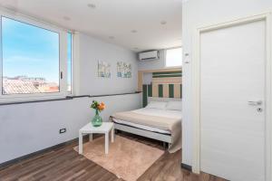 Ένα ή περισσότερα κρεβάτια σε δωμάτιο στο Garibaldi Rooms