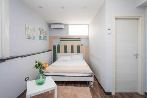 Ένα ή περισσότερα κρεβάτια σε δωμάτιο στο Garibaldi Rooms