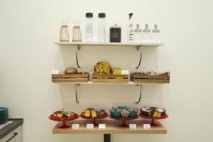 a shelf filled with different types of food at Villa Angelina in Pompei +52 photos