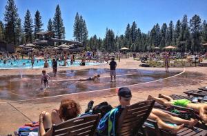 a group of people sitting in chairs at a swimming pool at Sunriver Vacation House in Sunriver +12 photos