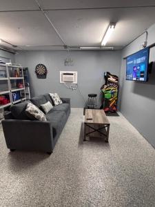 a living room with a couch and a table at Beach Retreat Oceanview Townhome with Pool & Game Room - Steps to Beach in Clearwater Beach