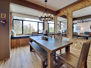 a dining room with a wooden table and chairs at 1849 Condos 542 condo in Mammoth Lakes