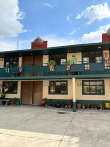 a large building with a lot of windows and balconies at Hotel Zaragoza in Puebla +9 photos