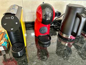 a red and black mixer sitting on a counter next to at Honey Factory House in Santa Cruz