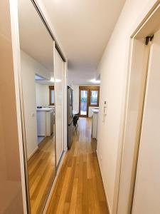 a hallway of a house with a mirror at Apartment Tatiana in Belgrade