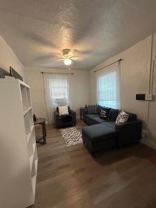 a living room with two couches and a couch at Soothing bungalow with AC in Pompano in Pompano Beach