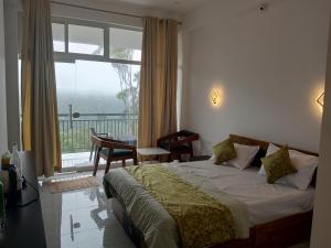 Afbeelding uit fotogalerij van The Fortunara Crown Munnar in Munnar