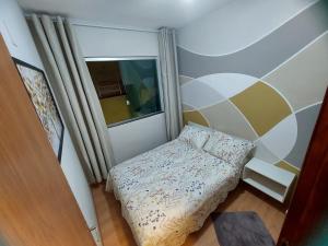 Una cama o camas en una habitación de Casa Completa Aconchegante e Decorada