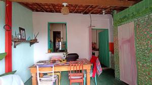 a room with a table and chairs in a room at Pelourinho House Experience in Salvador