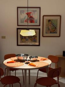 a white table with two bowls on top of it at Fun House Tampiquito in Monterrey