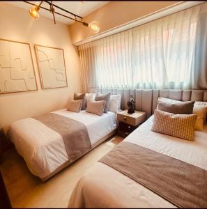 Ένα ή περισσότερα κρεβάτια σε δωμάτιο στο Logement de luxe avec piscine, hivernage +32 φωτογραφίες