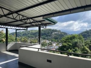 a view from the balcony of a house at Hilltop Retreat near Kandy Lake - Kings Residence in Kandy