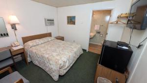 Ένα ή περισσότερα κρεβάτια σε δωμάτιο στο Restwel Motel