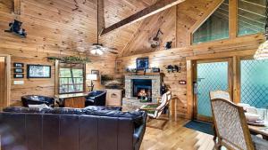 a living room with a couch and a fireplace at Moonshine Mountain in Catlettsburg