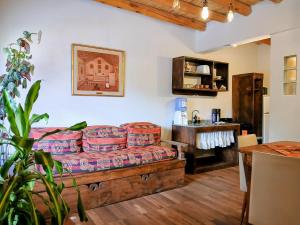 a living room with a couch and a table at Guasamayo in Tilcara
