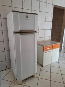 Η κουζίνα ή μικρή κουζίνα στο Suíte Aconchegante