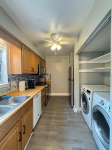 a kitchen with a washing machine and a washer and dryer at 3 bedroom Town home in Charlotte