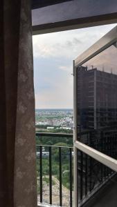 a view of a city from a balcony at NIRA Luxe stay in Lucknow