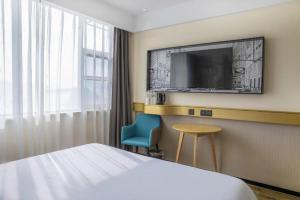 TV a/nebo společenská místnost v ubytování City Comfort Inn Yichang Zigui Three Gorges Dam Binhu