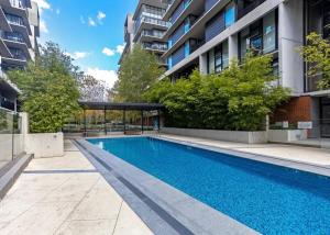 a swimming pool in the middle of a building at Cozy 2B apartment in Belconnen GYM POOL in Belconnen