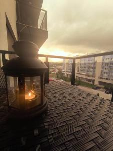 a candle sitting on top of a balcony at EastWest Nest Sarajevo in Vogošća +13 photos