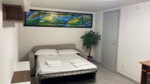 Postel nebo postele na pokoji v ubytování Alloggio turistico La Taverna