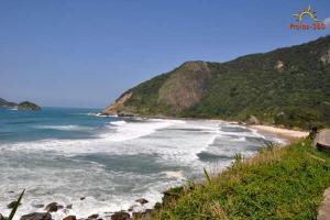 a view of a beach with the ocean at Barra Rio Centro in Rio de Janeiro