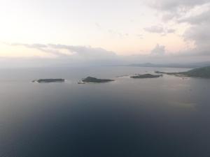 an island in the middle of a large body of water at Krisna Bungalows and Restaurant in Sekotong