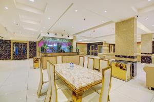 Et opholdsområde på Hotel O Kinsfolk Inn + 51 billeder