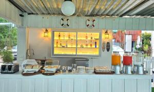 a food cart with a counter with food on it at The Regizt Jomtien Pattaya in Jomtien Beach +19 photos