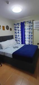 Postel nebo postele na pokoji v ubytování Arlu's Place 2 Bedroom Condo