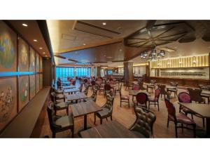 a restaurant with wooden tables and chairs and a cafeteria at Hotel Grand Mer Sankaiso - Vacation STAY 69633v in Kawajiri