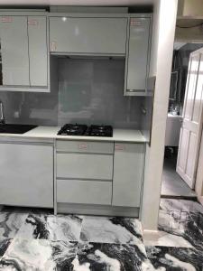 a kitchen with white cabinets and a stove at 96TR Double bed bedroom - Edmonton green in Edmonton