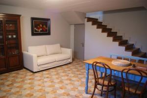 a living room with a couch and a table at The Arcadian in Vitina