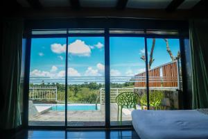 Postel nebo postele na pokoji v ubytování Novem Eco Resort