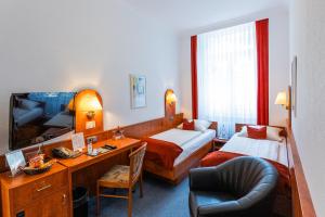 Säng eller sängar i ett rum på Hotel West an der Bockenheimer Warte